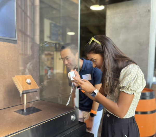 Sophomore Samaara Patil takes a picture of the San Francisco Giants 2012 World Series Ring. The Giants have won three World Series titles: in 2010, 2012 and 2014.